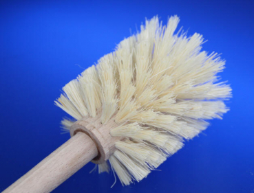 Universal cleaning brush with fiber placement