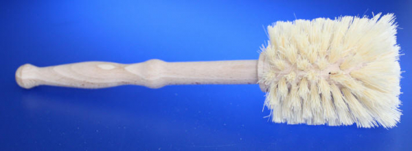 Universal cleaning brush with fiber placement